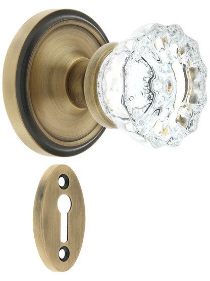 Classic Rosette Mortise Lock Set With Fluted Crystal Door Knobs in Antique Brass.